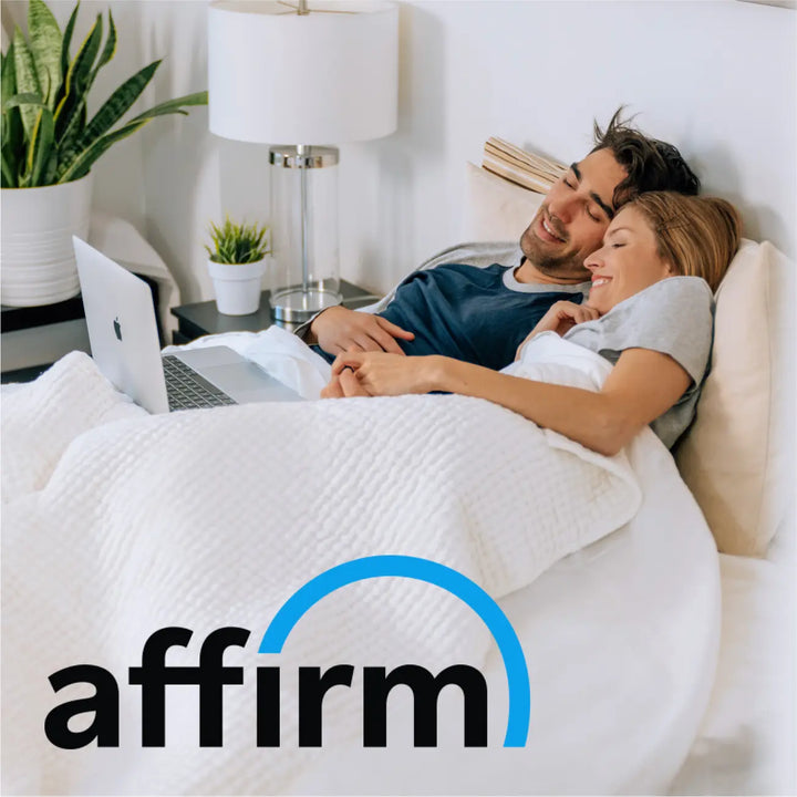 A couple laying in bed and looking at a mattress and the Affirm logo in the bottom left corner