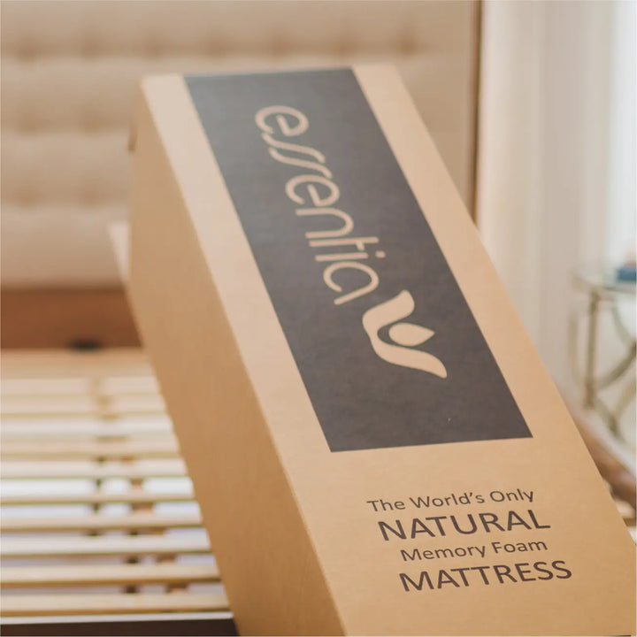 A shipping box with the Essentia mattress on it